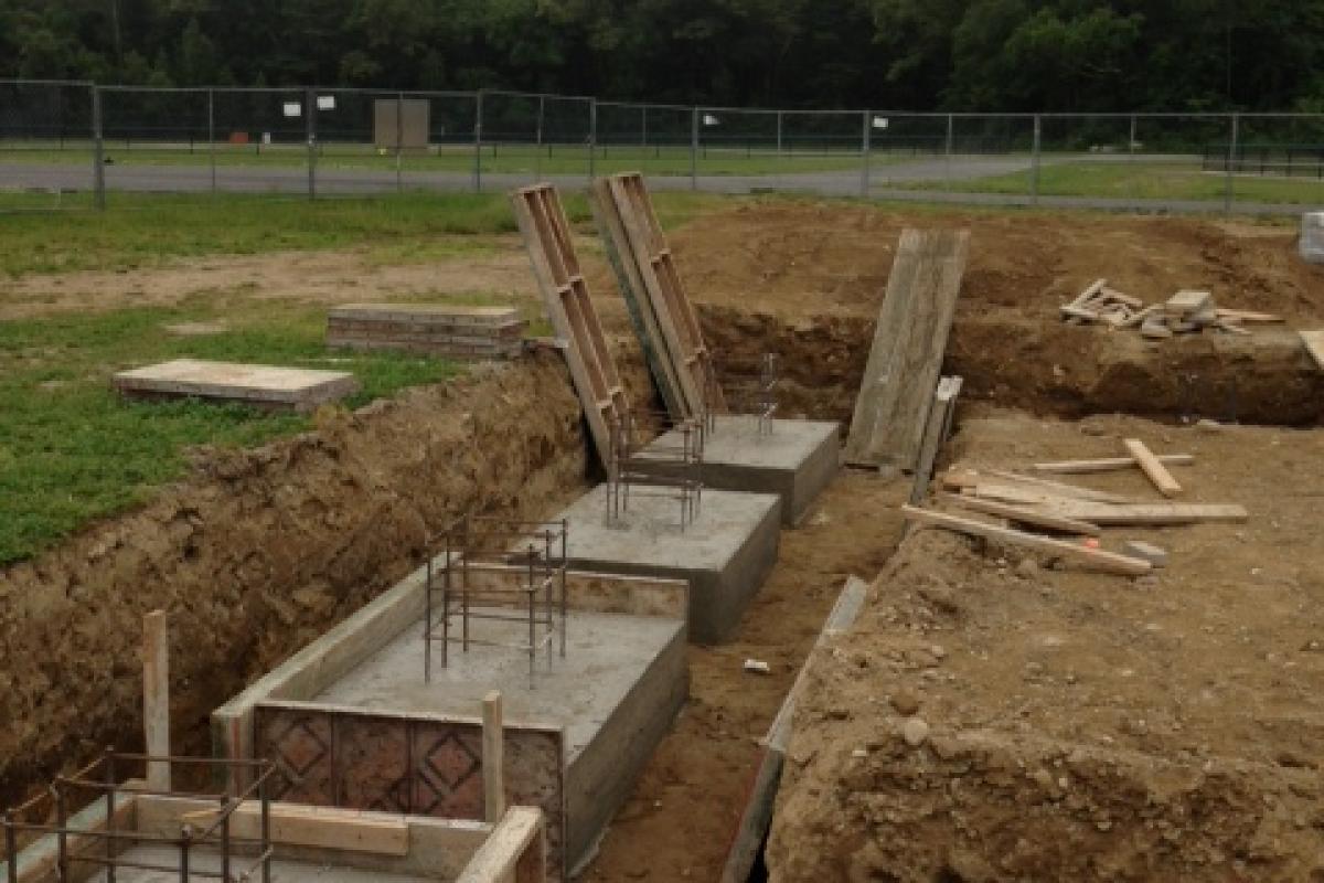 Footings being poured for the new pavilion at Forge Pond Park (photo 2, 6/28/13)